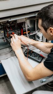 Electrician working on electrical wiring